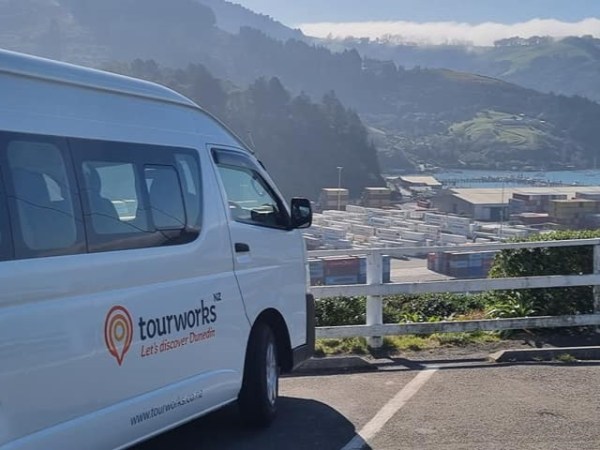 tourworks nz's van overlooking dunedin, new zealand