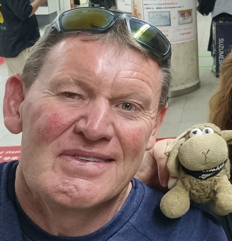 a man holding a teddy bear